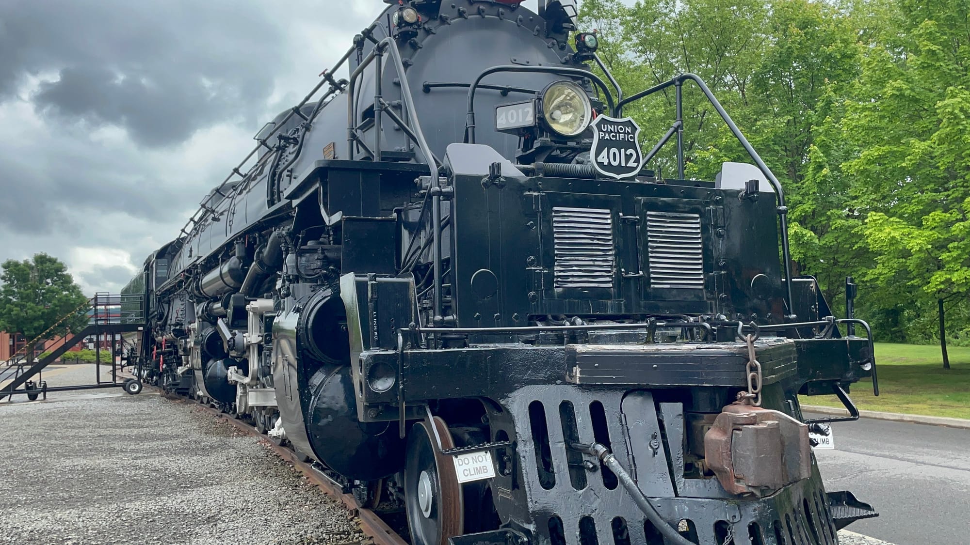 A gray and black steam locomotive from the front. The shield underneath the headlight says Union Pacific 4012