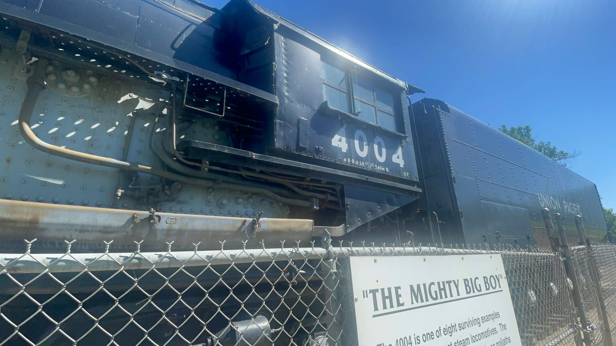 Cab of a steam locomotive. The black boiler jacket and tender is visible. The letter reads 4004 under the glass window. The tender says Union Pacific