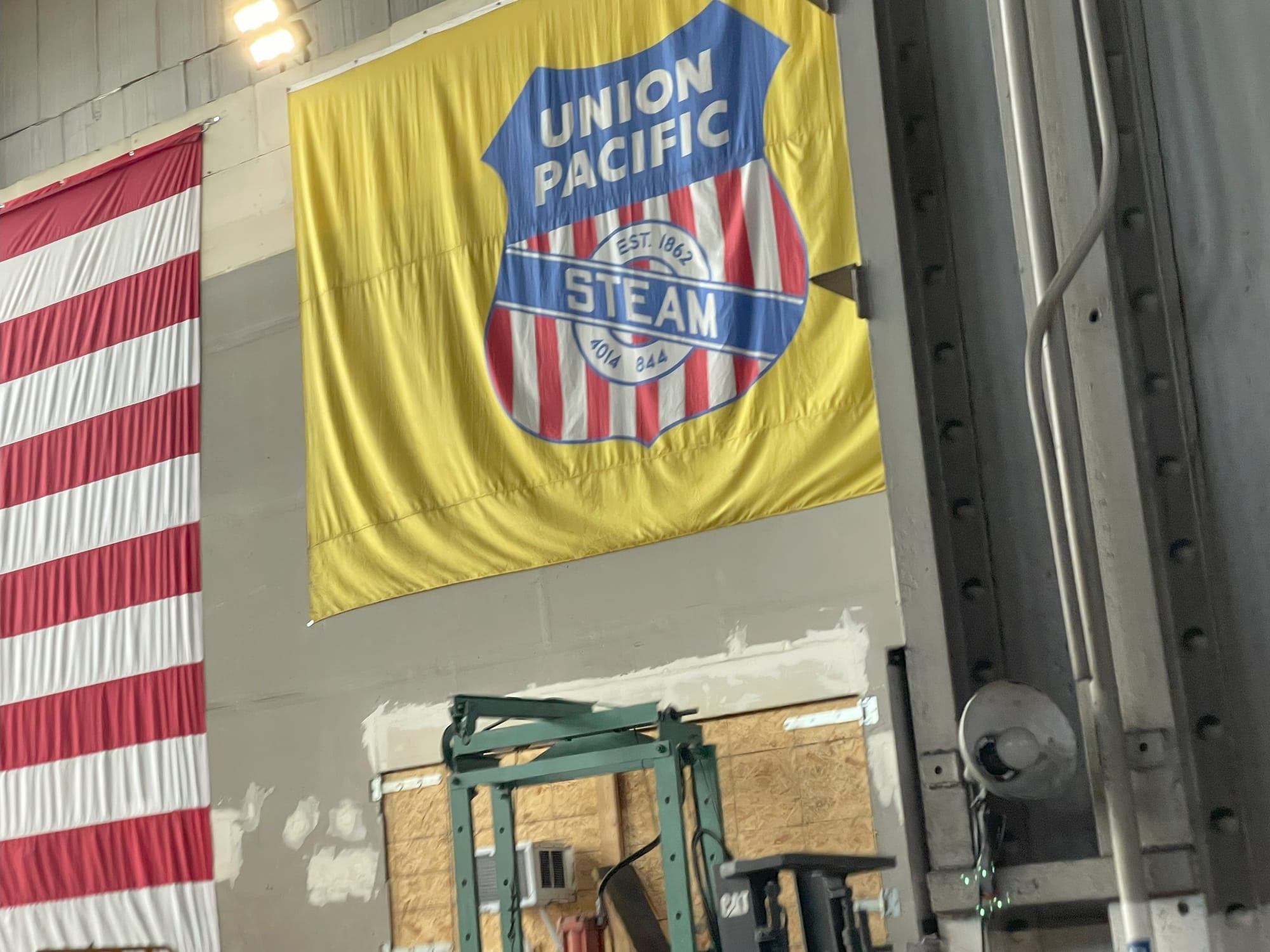 Yellow banner with the Red, white, and blue, UP logo